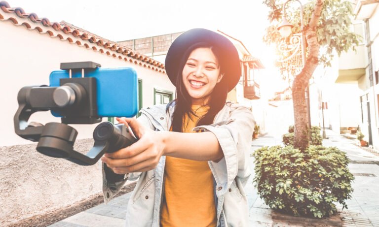 woman with camera videoing herself for youtube